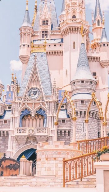 The iconic Walt Disney World Resort castle with clock and detailed architecture