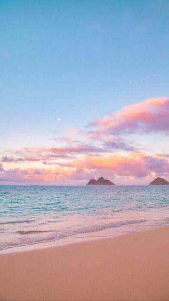 Calm ocean and pink clouds during summer sunset