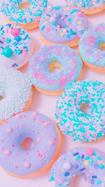 Colorful pastel sprinkles on donuts as summer treats with delicate colors