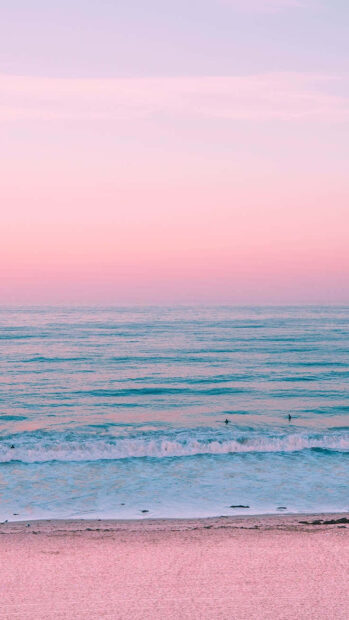 Pink Summer Wallpaper Mobile   A calm ocean scene during pink summer with gentle waves and a sandy beach