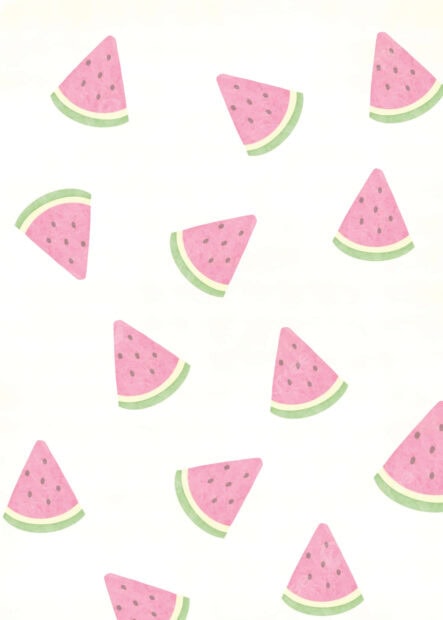 Pink summer pattern with watermelon slices scattered on a white background