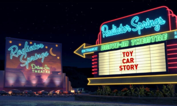 Neon signs of Radiator Springs drive in theatre at night in Radiator Springs scene