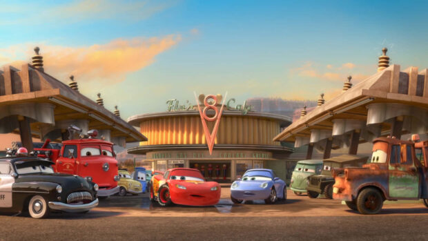 Radiator Springs characters gathered in front of Flo's V8 Cafe under a colorful sky