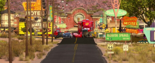 Radiator Springs town with animated vehicles and vintage signs on a sunny day