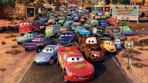 The Radiator Springs town filled with colorful cars from the animated movie Cars in a sunny setting
