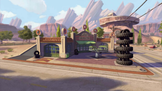 The Radiator Springs town with tire shop and desert mountains in the background