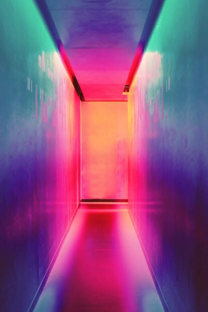 Vibrant summer colors create a glowing collage effect inside a narrow corridor
