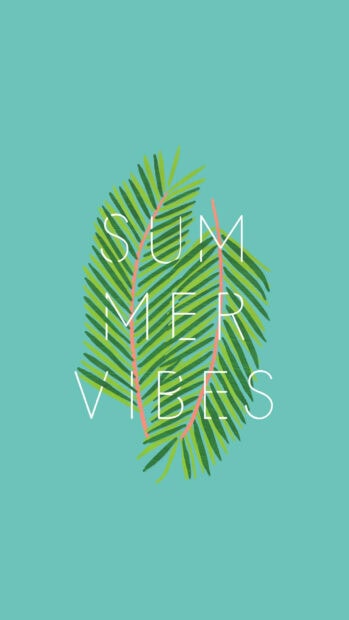 Green tropical leaf with summer vibes text on a turquoise background
