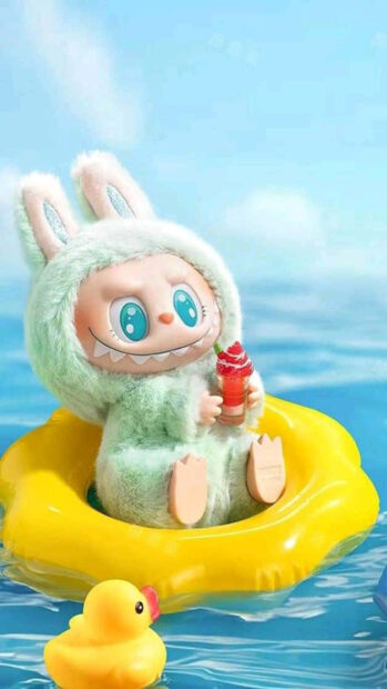 Cute character in bunny suit holding drink on yellow float in water during summer