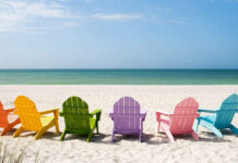 Colorful chairs on the beach with summer sea view