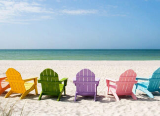 Colorful chairs on the beach with summer sea view