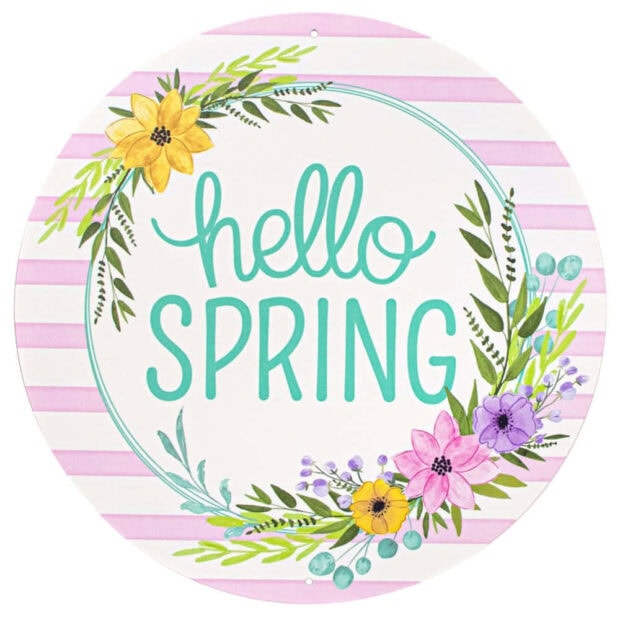 Round decorative plaque features a teal 