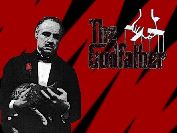 Don Corleone, dressed in a tuxedo with a red rose, gently holds a cat against a distressed red background featuring the title logo and puppet strings