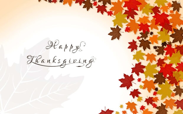 Stylized autumn leaves form a colorful border around elegant script text 