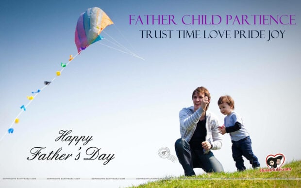Father crouches, son stands beside him, both watch a colorful kite soaring against a clear blue sky on a grassy hill