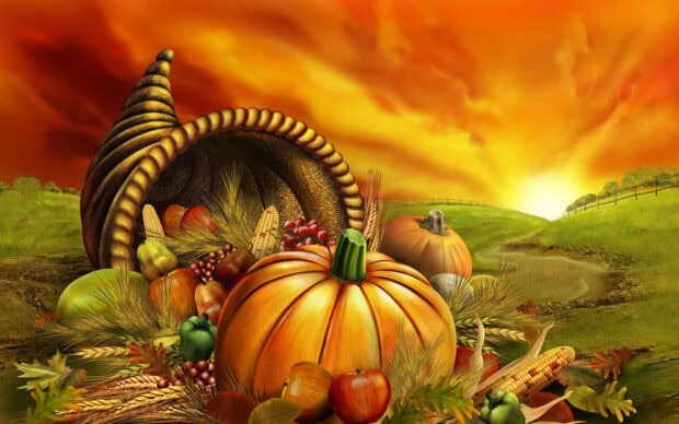 Cornucopia overflows with autumn produce, resting in a golden field under a vibrant sunset