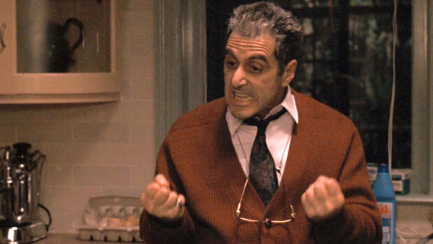 Michael Corleone expresses intense frustration, clenching his fists in a dimly lit kitchen scene, offering a Full HD viewing experience