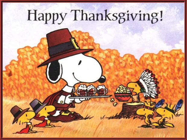 Snoopy, dressed as a pilgrim, serves mugs of root beer to Woodstock and friends in autumn foliage