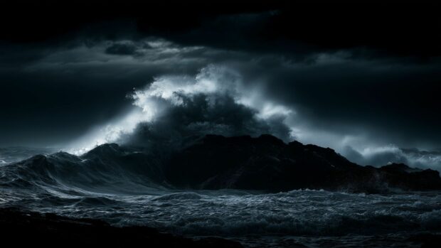 Black aesthetic wallpaper featuring a dramatic stormy ocean with huge waves crashing against dark rocks under a heavy sky