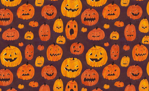 A fun Halloween iPad wallpaper pattern featuring many carved jack-o'-lanterns with various expressions on a dark background