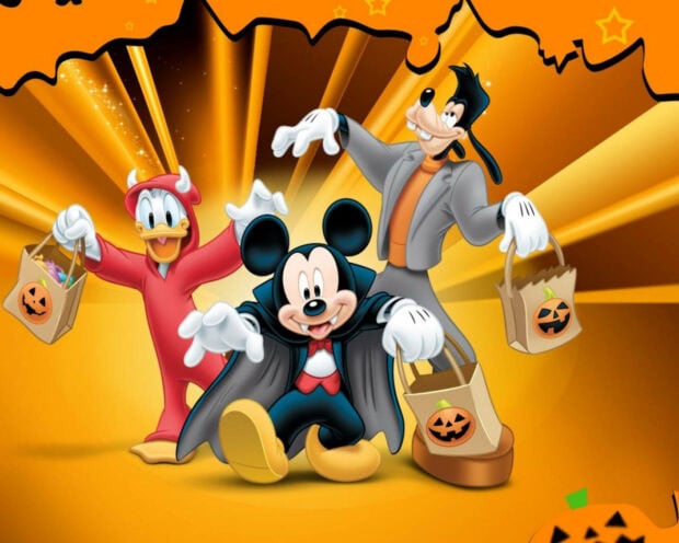 Cute Disney Halloween wallpaper featuring Mickey Mouse, Donald Duck, and Goofy in costumes trick-or-treating on an orange background