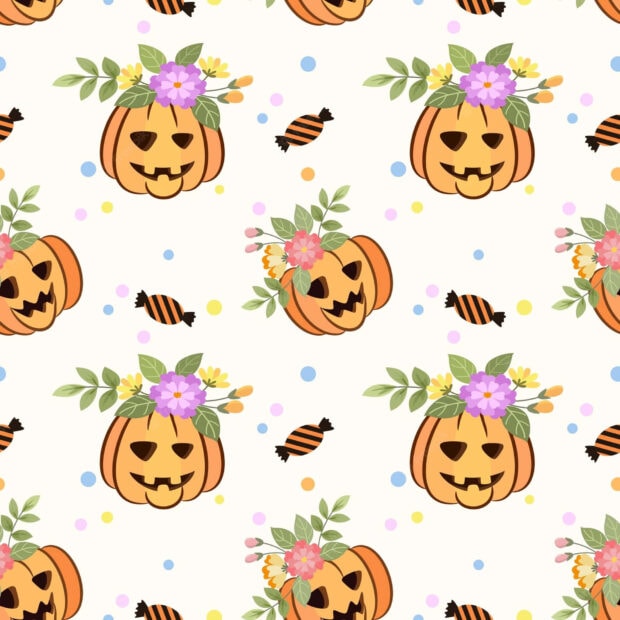 A cute Halloween wallpaper featuring a cheerful pattern of jack-o'-lanterns adorned with colorful flowers and striped candies on a light cream background