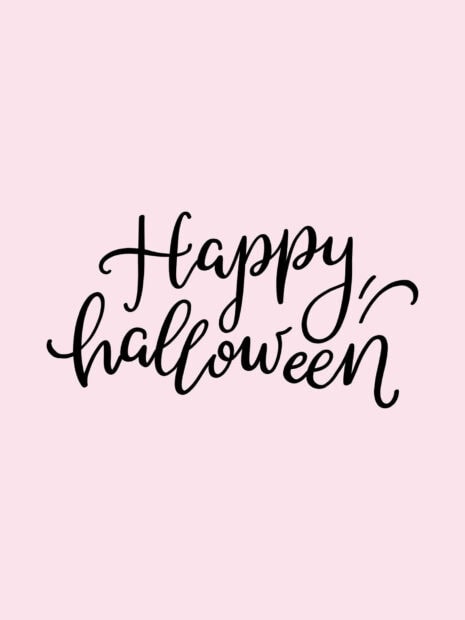 A cute Halloween wallpaper featuring elegant black script lettering that says 