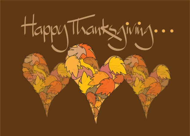 A cute Thanksgiving wallpaper with "Happy Thanksgiving" text above three heart shapes filled with colorful autumn leaves