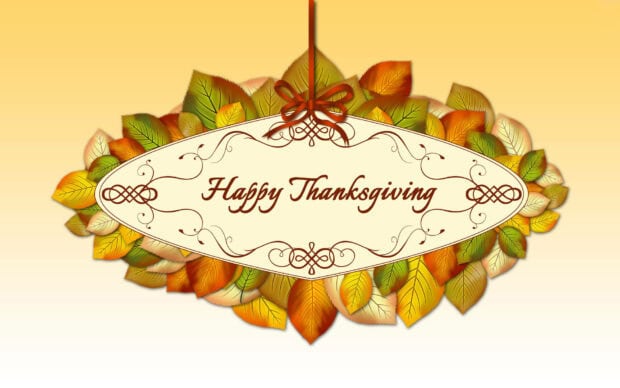 A cute Thanksgiving wallpaper featuring a "Happy Thanksgiving" sign framed by colorful autumn leaves