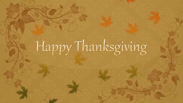 A cute Thanksgiving wallpaper featuring "Happy Thanksgiving" text surrounded by autumn leaves and decorative vines on a warm brown background