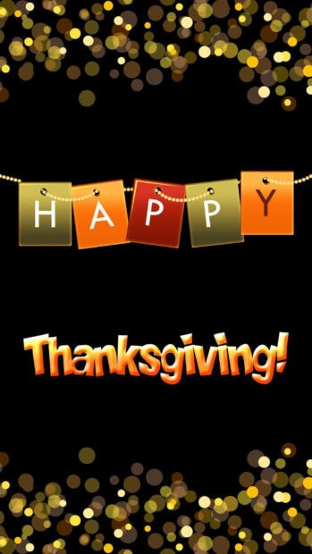 A cute Thanksgiving wallpaper with "Happy Thanksgiving!" text, featuring a garland of colorful letters and sparkling golden bokeh lights on a dark black background