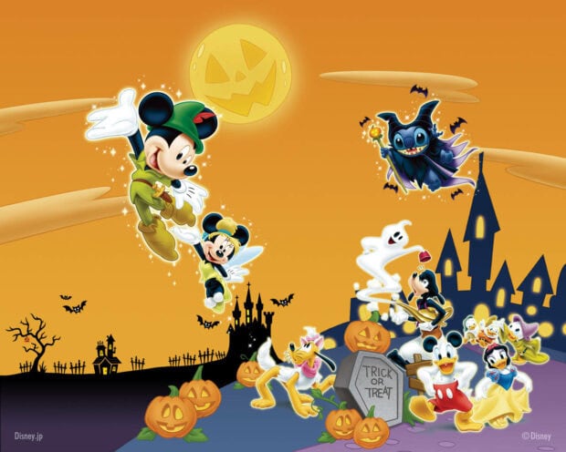 Cute Disney Halloween Wallpaper with Mickey and friends celebrating among pumpkins and spooky castles