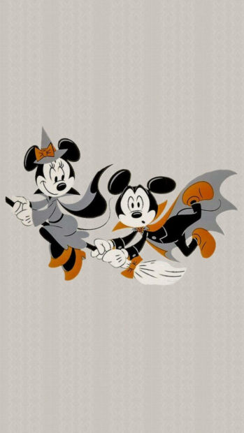 Cute Disney Halloween Wallpaper featuring Mickey and Minnie as a witch and vampire on a broomstick