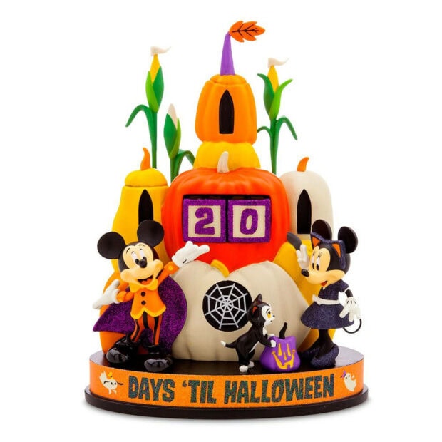 Disney Halloween wallpaper showing Mickey and Minnie Mouse figurines in Halloween costumes with a "Days 'Til Halloween" countdown