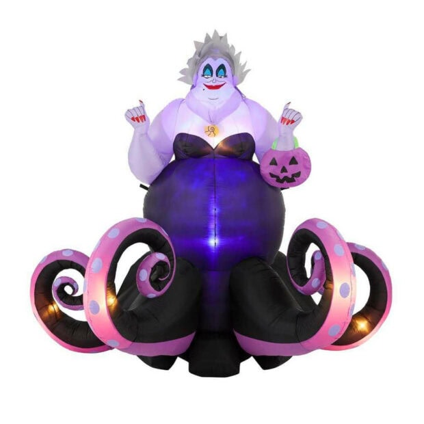 A Disney Halloween wallpaper of an inflatable Ursula from The Little Mermaid, holding a pumpkin bucket on a white background