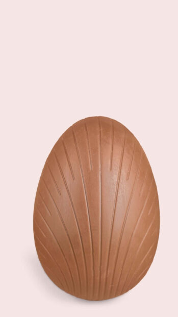 Easter Egg Wallpaper presenting a textured brown chocolate egg with shell patterns on a soft pink background