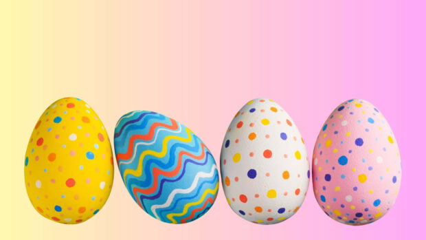 A bright Easter egg wallpaper displaying four colorful patterned eggs against a soft yellow and pink gradient background