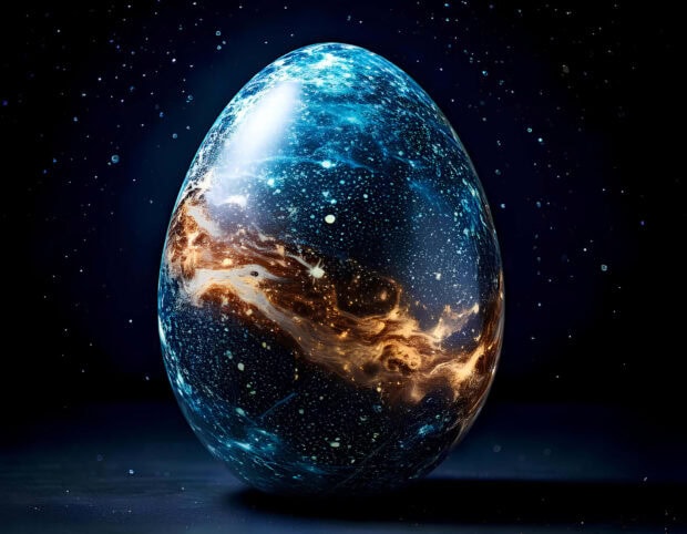 A stunning Easter Egg Wallpaper featuring a cosmic egg with blue and orange nebula patterns set against a starry dark space background