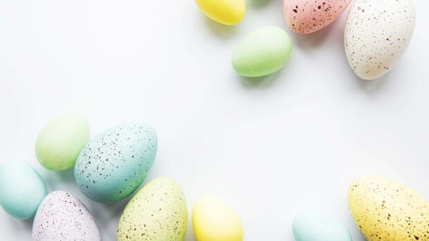 An elegant Easter egg wallpaper featuring various pastel-colored speckled eggs scattered on a clean white background
