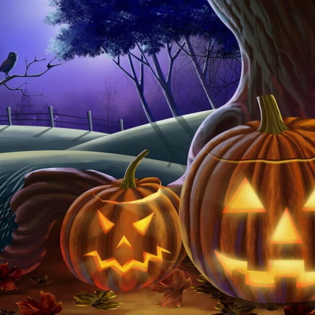 A festive Halloween iPad wallpaper featuring two glowing jack-o'-lanterns under a tree with a raven on a branch