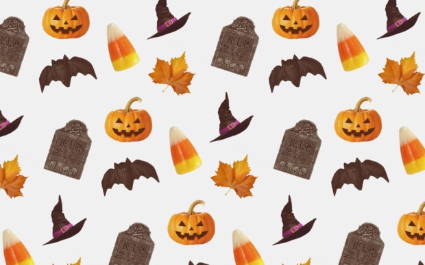 A white Halloween Macbook Wallpaper displaying a repeating pattern of jack-o'-lanterns, witch hats, candy corn, and gravestones