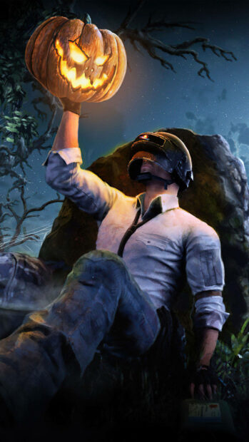 An atmospheric Halloween Pumpkin Wallpaper featuring a gamer character in a helmet holding a glowing jack-o'-lantern under a moonlit sky