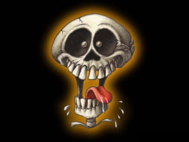 Halloween Skeleton Wallpaper featuring a funny cartoon skeleton head with its tongue out and drooling on a black background