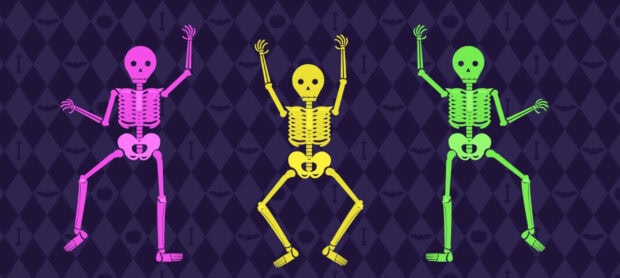 A playful Halloween Skeleton Wallpaper with three colorful cartoon skeletons dancing on a dark purple background