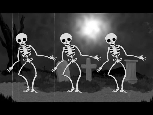Halloween Skeleton Wallpaper featuring three cartoon skeletons dancing in a vintage black and white film style graveyard scene
