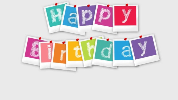 Its My Birthday Wallpaper showing colorful polaroid photo cards spelling out 'Happy Birthday' with pushpins on a light background