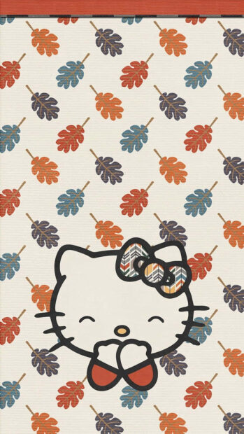 A charming Hello Kitty Fall wallpaper featuring Hello Kitty's head with a patterned bow against a background of scattered blue, orange, and brown autumn leaves