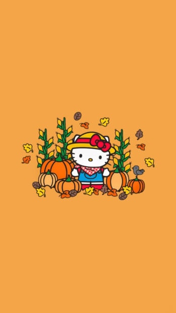 An adorable Hello Kitty Fall Wallpaper depicting Hello Kitty in a farmer outfit amidst pumpkins, corn stalks, and autumn leaves on an orange background