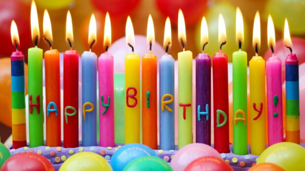 Its My Birthday Wallpaper showing a row of colorful lit candles spelling 'Happy Birthday'
