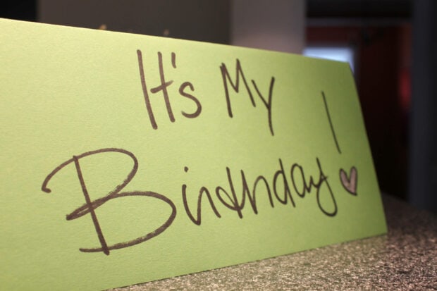 Its My Birthday Wallpaper featuring a green card with 'It's My Birthday!' handwritten in brown marker with a heart